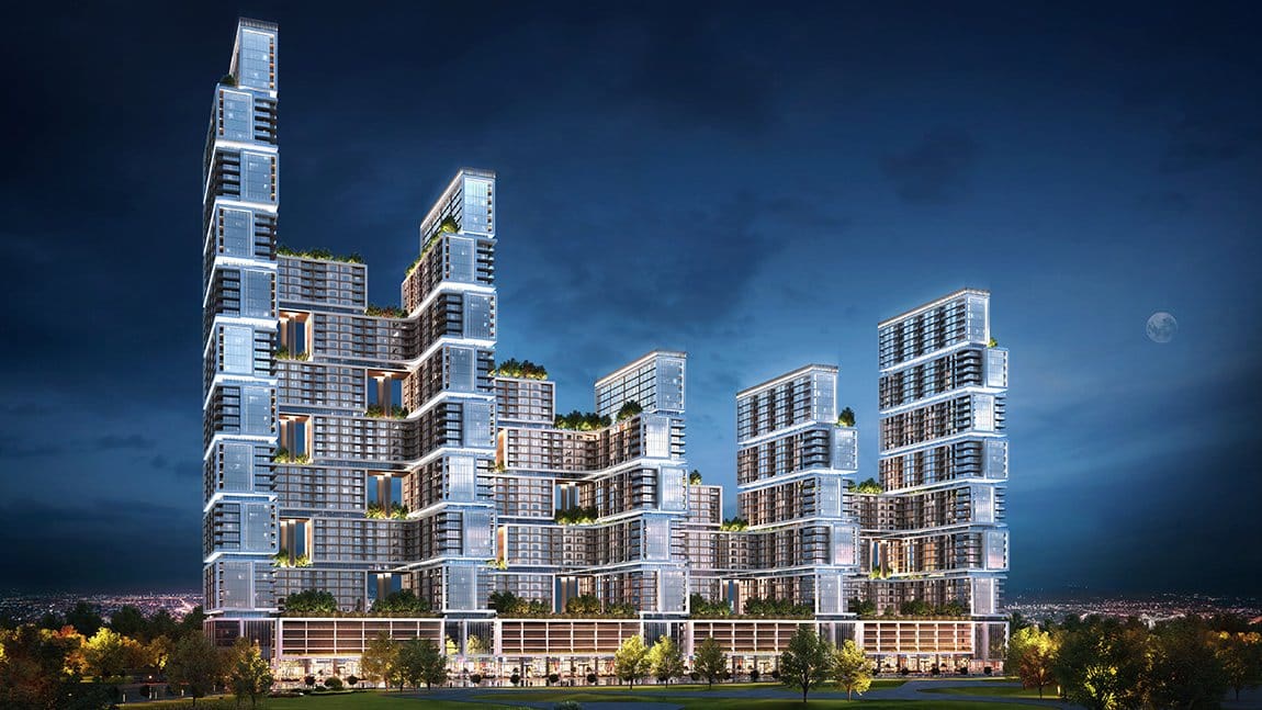 Sobha One five interconnected towers illuminated at night